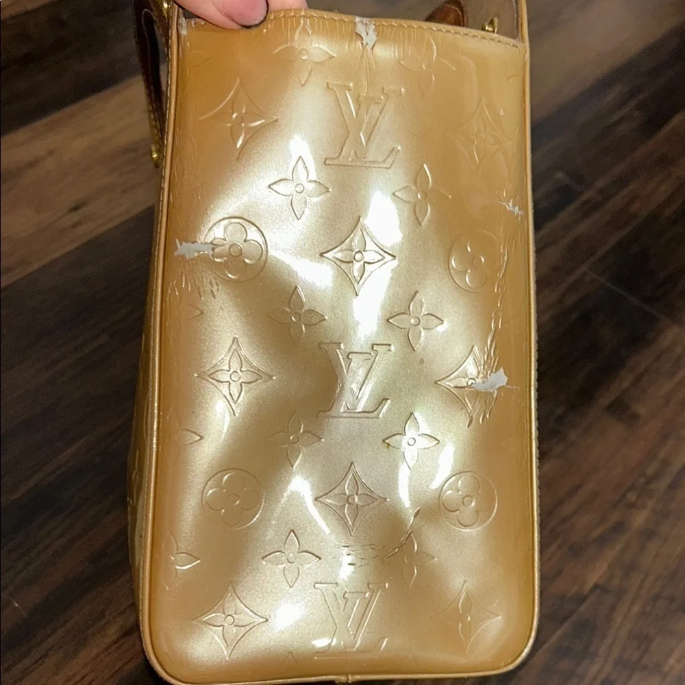 LOUIS VUITTON Gold Tote with Iconic Embossed Design